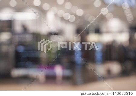 Store Interior Blurred Retail Space With Overhead Lights And Indistinct Displays In Shopping Mall Store Interior Blurred Retail Space With Overhead Lights And Indistinct Displays In Shopping Mall 143053510