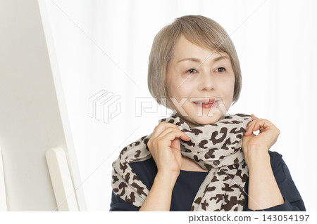 Senior women choosing scarves to dress stylishly Senior women choosing scarves to dress stylishly 143054197