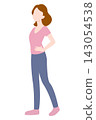 A woman standing with her hands on her hips. 143054538