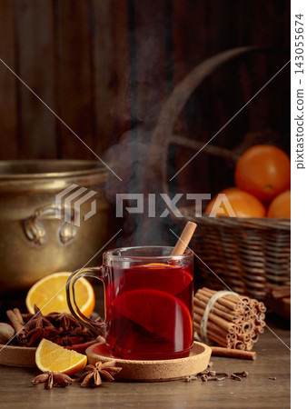 Mulled wine with ingredients on an old wooden table. Mulled wine with ingredients on an old wooden table. 143055674