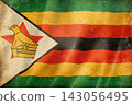Old vintage flag of Zimbabwe, worn and stained 143056495