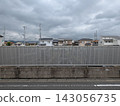 A cemetery located in a residential area, with privacy fences to show consideration for the neighbors. 143056735
