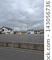 A cemetery (vertical type) located in a residential area, with privacy fences to show consideration for the neighbors. 143056736