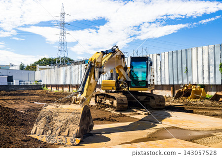 Construction site, heavy equipment, backhoe Construction site, heavy equipment, backhoe 143057528