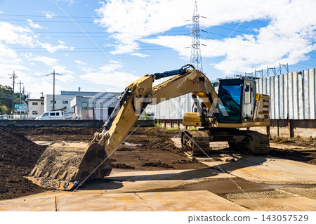 Construction site, heavy equipment, backhoe Construction site, heavy equipment, backhoe 143057529