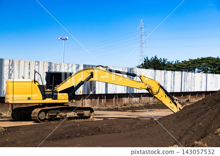 Construction site, heavy equipment, backhoe Construction site, heavy equipment, backhoe 143057532