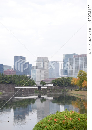The moat of the Imperial Palace and the skyscrapers of Marunouchi, Tokyo. The moat of the Imperial Palace and the skyscrapers of Marunouchi, Tokyo. 143058165