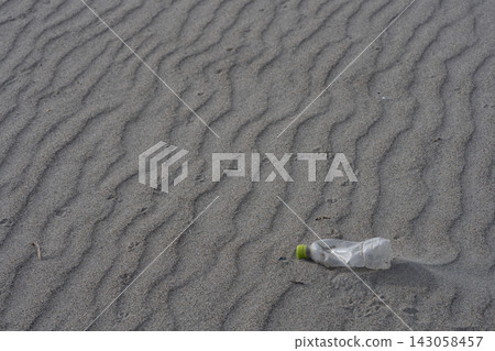 Plastic bottles washed up on the beach Plastic bottles washed up on the beach 143058457