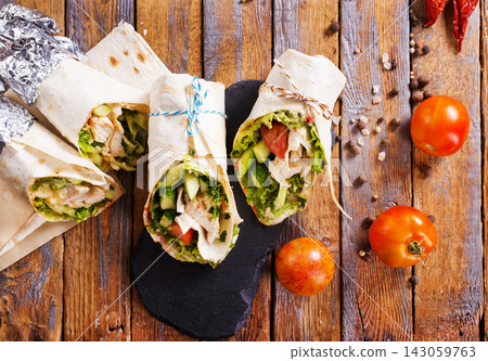 Lavash roll with meat and ham, and cheese Lavash roll with meat and ham, and cheese 143059763