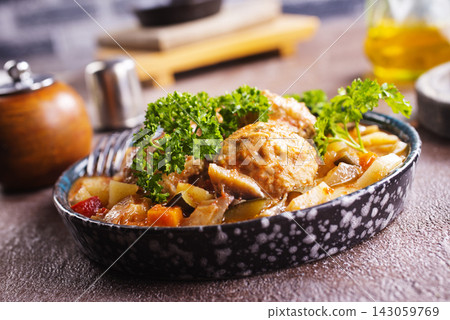 Hearty beef stew with potato, green beans, carrot, peas and corn, in ceramic bowl Hearty beef stew with potato, green beans, carrot, peas and corn, in ceramic bowl 143059769