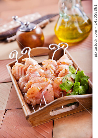 Raw chicken breast or fillet with pepper, garlic and fresh herbs Raw chicken breast or fillet with pepper, garlic and fresh herbs 143059861