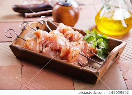 Raw chicken breast or fillet with pepper, garlic and fresh herbs Raw chicken breast or fillet with pepper, garlic and fresh herbs 143059862