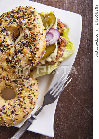 Hearty Breakfast Sandwich on a Bagel with cutlets and pickled cucumber Hearty Breakfast Sandwich on a Bagel with cutlets and pickled cucumber 143059885