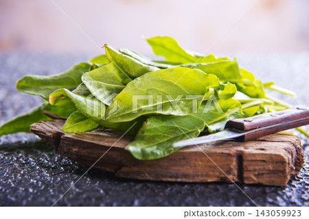Sorrel. Bunch of fresh green organic sorrel leaf on a table Sorrel. Bunch of fresh green organic sorrel leaf on a table 143059923