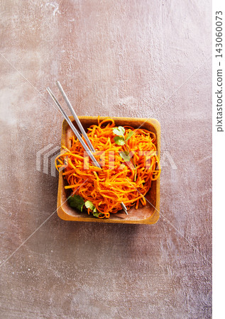 Spicy korean carrot salad in bowl Spicy korean carrot salad in bowl 143060073