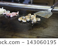 Grilling the oysters for oyster okonomiyaki Grilling the oysters for oyster okonomiyaki 143060195