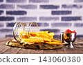 Crisp golden brown curly fried potato 143060380