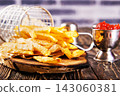 Crisp golden brown curly fried potato 143060381