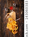 Crisp golden brown curly fried potato 143060383