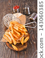 Crisp golden brown curly fried potato  143060385