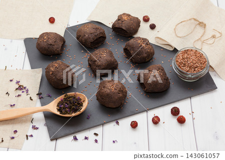 Homemade linen bread buns with till seeds, no gluten without the yeast, healthy dietary food, side perspective view Homemade linen bread buns with till seeds, no gluten without the yeast, healthy dietary food, side perspective view 143061057