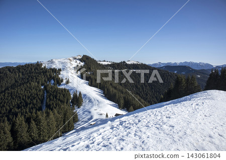 Snowy landscape at Hornle Mountain, alpine foothills in Bavaria, Germany Snowy landscape at Hornle Mountain, alpine foothills in Bavaria, Germany 143061804