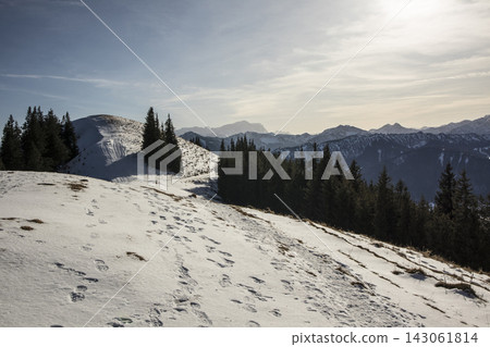 Snowy landscape at Hornle Mountain, alpine foothills in Bavaria, Germany Snowy landscape at Hornle Mountain, alpine foothills in Bavaria, Germany 143061814