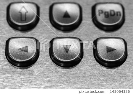 Close-up black and white photo of metal navigation buttons Close-up black and white photo of metal navigation buttons 143064326