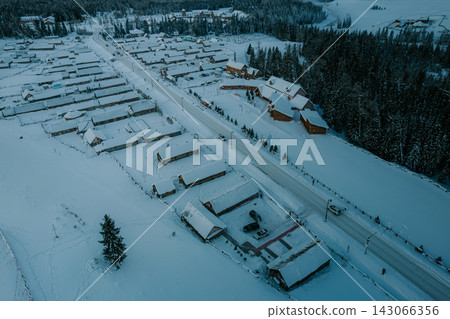 Snow-covered wooden houses lined up in Canas Snow-covered wooden houses lined up in Canas 143066356