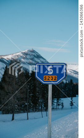 A sign for Provincial Highway 232 with snow-capped mountains in the background. A sign for Provincial Highway 232 with snow-capped mountains in the background. 143066366