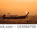 The sun above the bow of a longtail boat in the Phi Phi Islands 143066706