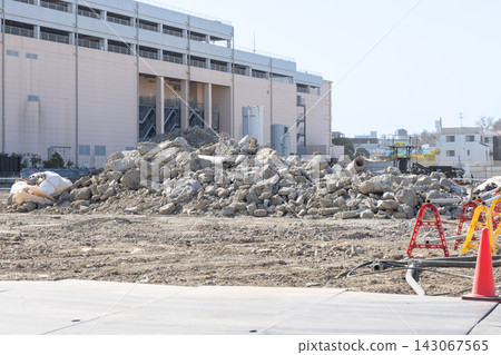 A mountain of concrete rubble piled up at a large construction site. A mountain of concrete rubble piled up at a large construction site. 143067565