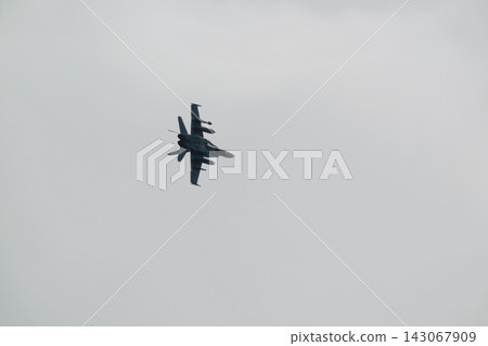 F 18 fighter jet flying in the sky F 18 fighter jet flying in the sky 143067909