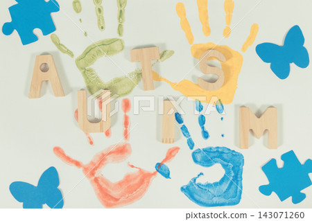 Kids handprint made of paint on white background. Autism spectrum disorder Kids handprint made of paint on white background. Autism spectrum disorder 143071260