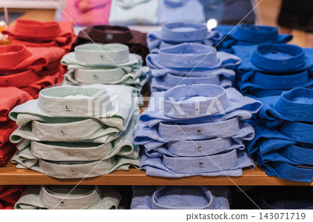 Colorful Collared Shirts Folded in Neat Stacks Colorful Collared Shirts Folded in Neat Stacks 143071719