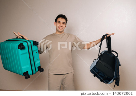 Cheerful traveler debating travel options, weighing hard shell suitcase against casual backpack, symbolizing decision making process for upcoming holiday journey or backpacking experience. Cheerful traveler debating travel options, weighing hard shell suitcase against casual backpack, symbolizing decision making process for upcoming holiday journey or backpacking experience. 143072001