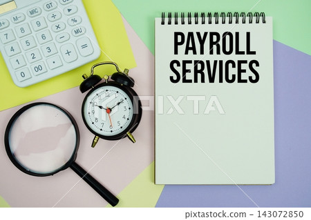 Payroll Services text with calculator, alarm clock and magnifying glass Business and Financial Concept Payroll Services text with calculator, alarm clock and magnifying glass Business and Financial Concept 143072850