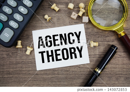 Agency Theory text written on notepad with pen, alarm clock, magnifying glass and calculator on wooden background Agency Theory text written on notepad with pen, alarm clock, magnifying glass and calculator on wooden background 143072853