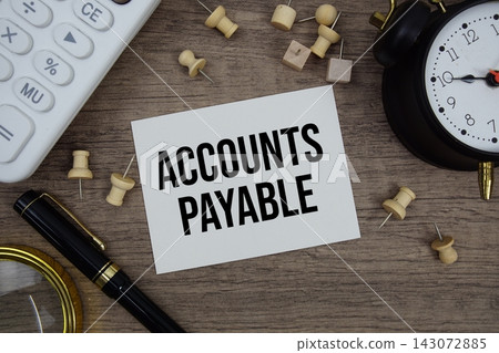 Accounts Payable text written on notepad with pen, alarm clock, magnifying glass and calculator on wooden background Accounts Payable text written on notepad with pen, alarm clock, magnifying glass and calculator on wooden background 143072885