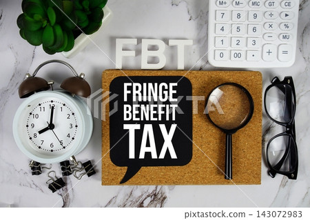 FBT Fringe Benefit Tax acronym with calculator, alarm clock and magnifying glass, Business and Financial concept background FBT Fringe Benefit Tax acronym with calculator, alarm clock and magnifying glass, Business and Financial concept background 143072983