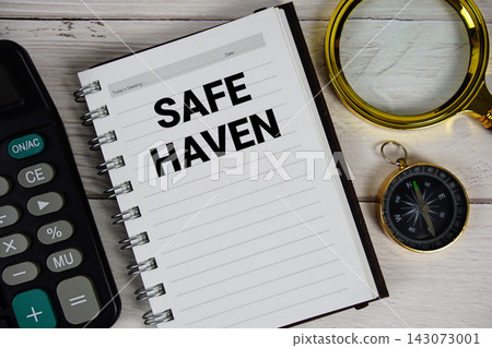 Safe Haven text with money bag and alarm clock on wooden background Safe Haven text with money bag and alarm clock on wooden background 143073001