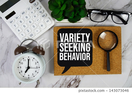 Variety-Seeking Behavior text with calculator and magnifying glass on marble background 143073046