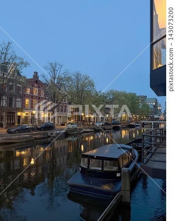 Boat and canal in Amsterdam, the Netherlands Boat and canal in Amsterdam, the Netherlands 143073200