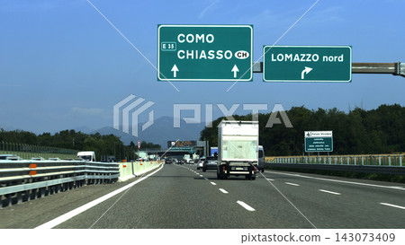 Signs directing traffic to Como and Lomazzo Signs directing traffic to Como and Lomazzo 143073409