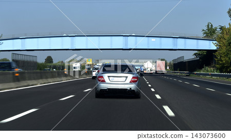 Busy Italian motorway driving Busy Italian motorway driving 143073600