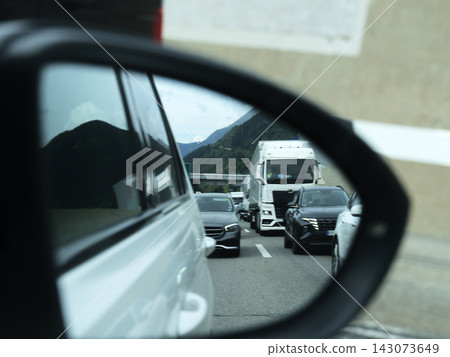 Traffic on Italian autostrada mirrored Traffic on Italian autostrada mirrored 143073649