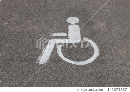 Wheelchair accessible parking sign painted on asphalt Wheelchair accessible parking sign painted on asphalt 143073887