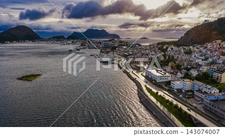 Aerial view of Alesund coastal town with harbor, mountains and fjord, Norway Aerial view of Alesund coastal town with harbor, mountains and fjord, Norway 143074007