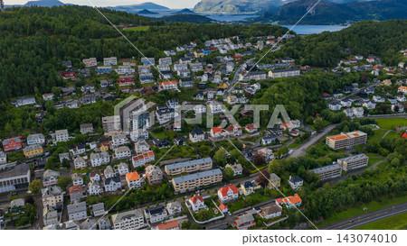 Aerial view of Fjelltun residential area, Alesund Norway with forested valleys and coastal fjords Aerial view of Fjelltun residential area, Alesund Norway with forested valleys and coastal fjords 143074010