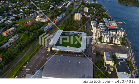 Aerial view of football stadium and waterfront residential district, Alesund Norway Aerial view of football stadium and waterfront residential district, Alesund Norway 143074012